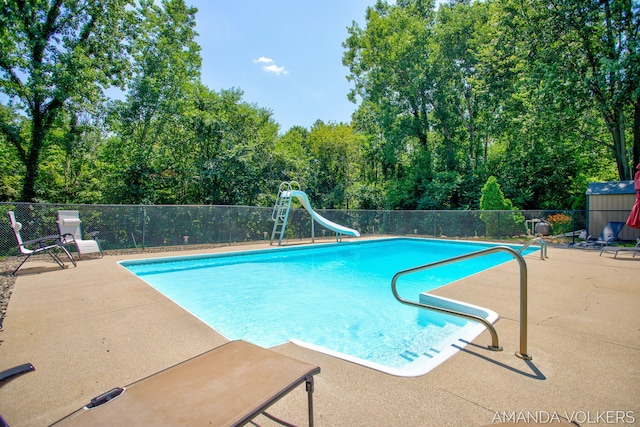 8608 Woodruff Dr SW, Byron Center, MI 49315 - view of pool featuring a water slide and a patio area