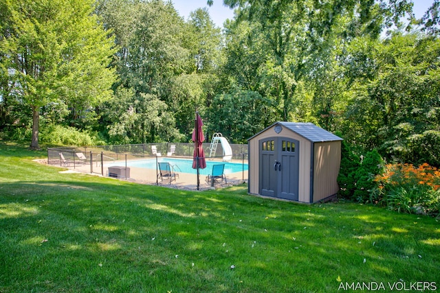 8608 Woodruff Dr SW, Byron Center, MI 49315 - view of swimming pool featuring a shed, a water slide, and view of scattered trees