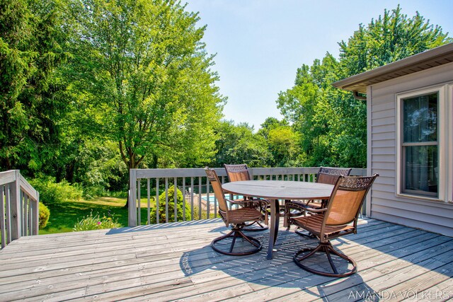 8608 Woodruff Dr SW, Byron Center, MI 49315 - wooden terrace with outdoor dining space