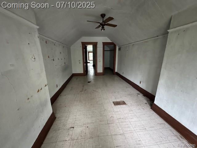 566 Elm St, Wyandotte, MI 48192 - bonus room featuring tile patterned floors, lofted ceiling, and ceiling fan