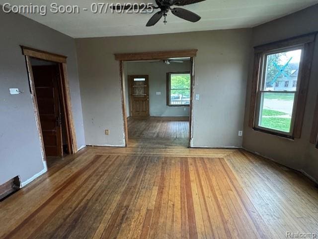 566 Elm St, Wyandotte, MI 48192 - spare room with a ceiling fan and hardwood / wood-style floors