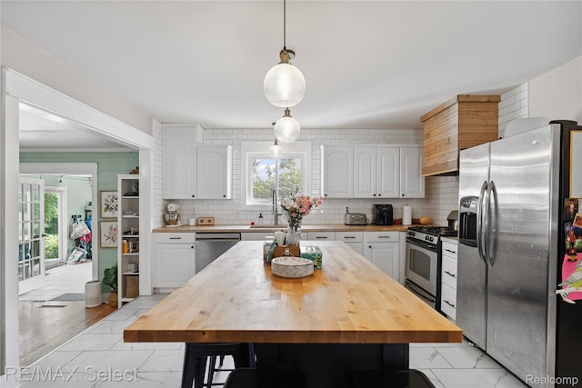 1406 Country View Ln, Flint, MI 48532 - kitchen with stainless steel appliances, butcher block counters, white cabinetry, and backsplash