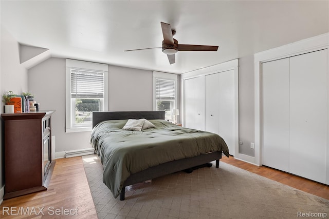 1406 Country View Ln, Flint, MI 48532 - bedroom with light wood-type flooring, two closets, and a ceiling fan