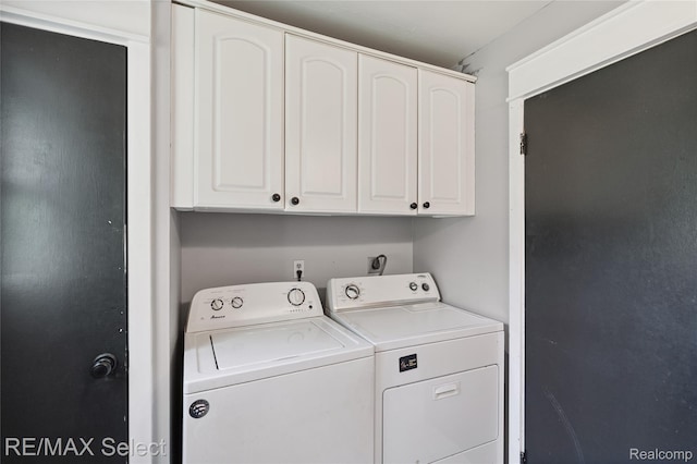 1406 Country View Ln, Flint, MI 48532 - laundry area featuring washer and dryer and cabinet space