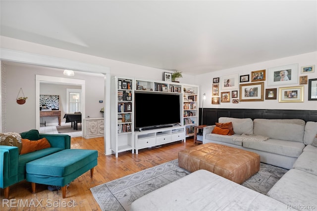 1406 Country View Ln, Flint, MI 48532 - living room featuring wood finished floors and a wainscoted wall