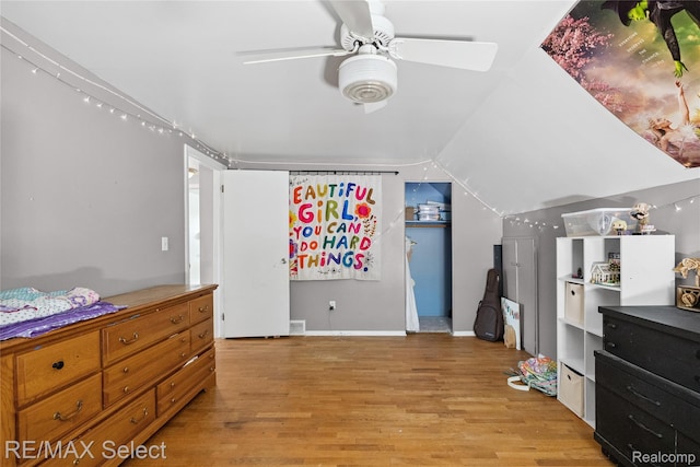 1406 Country View Ln, Flint, MI 48532 - bedroom with light wood finished floors, vaulted ceiling, and a ceiling fan