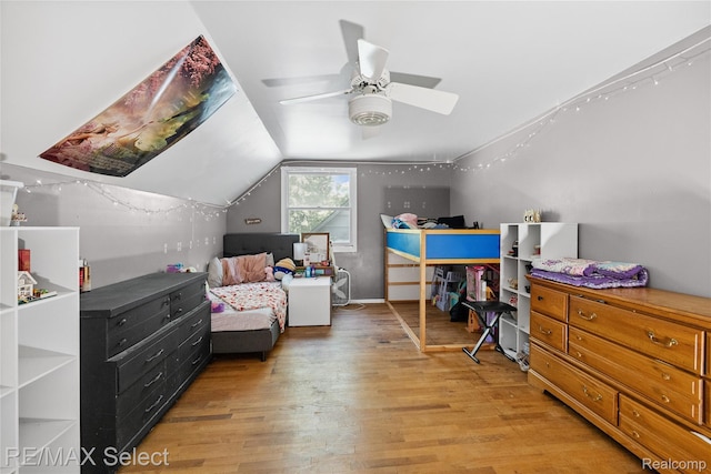 1406 Country View Ln, Flint, MI 48532 - bedroom with light wood-style floors, lofted ceiling, and ceiling fan
