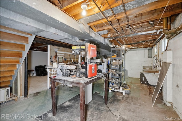 1406 Country View Ln, Flint, MI 48532 - unfinished below grade area featuring a workshop area and stairway