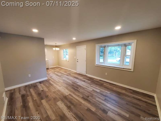 4638 Gertrude St, Dearborn Heights, MI 48125 - spare room with a chandelier, recessed lighting, and dark wood-style flooring