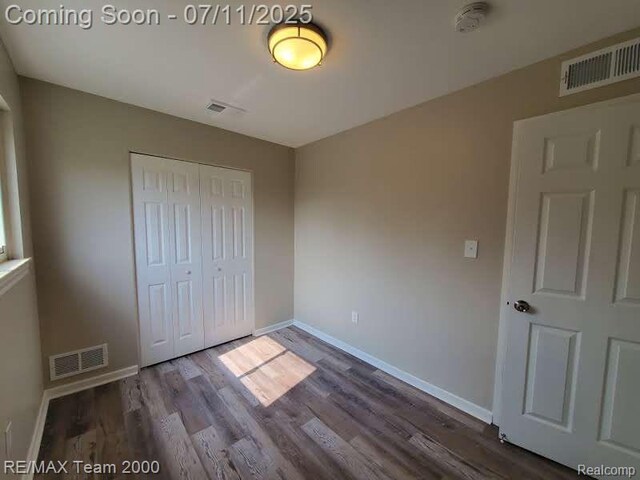 4638 Gertrude St, Dearborn Heights, MI 48125 - unfurnished bedroom featuring wood finished floors and a closet