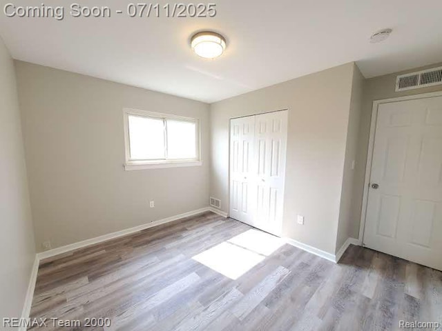 4638 Gertrude St, Dearborn Heights, MI 48125 - unfurnished bedroom with wood finished floors and a closet