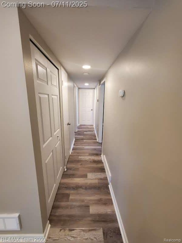 4638 Gertrude St, Dearborn Heights, MI 48125 - hallway featuring wood finished floors and baseboards