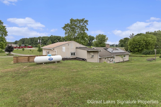 6047 Belding Rd, Belding, MI 48809 - back of property featuring solar panels and a chimney