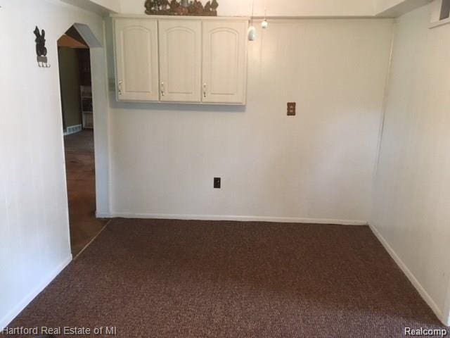 7170 Kempa Ave, Romulus, MI 48174 - spare room featuring carpet floors and arched walkways