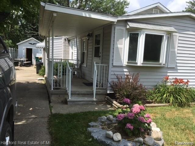 7170 Kempa Ave, Romulus, MI 48174 - view of front of house featuring a shed and a porch