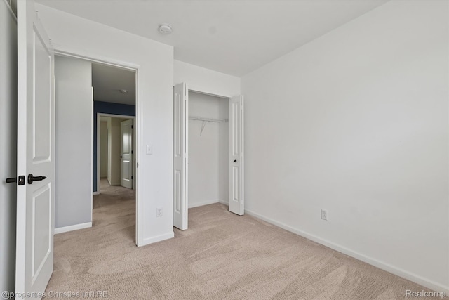 1051 N Sherman Dr Unit B19, Royal Oak, MI 48067 - unfurnished bedroom featuring light colored carpet and a closet