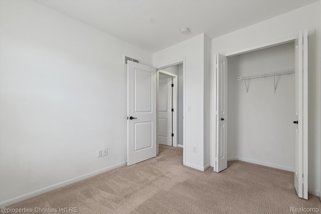 1051 N Sherman Dr Unit B19, Royal Oak, MI 48067 - unfurnished bedroom with light carpet and a closet
