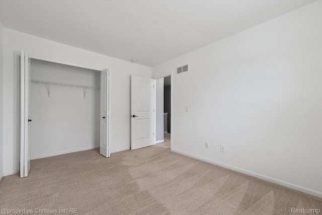 1051 N Sherman Dr Unit B19, Royal Oak, MI 48067 - unfurnished bedroom with light colored carpet and a closet