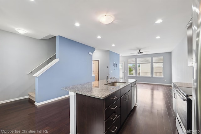 1051 N Sherman Dr Unit B19, Royal Oak, MI 48067 - kitchen with stainless steel appliances, dark wood finished floors, ceiling fan, a kitchen island with sink, and recessed lighting