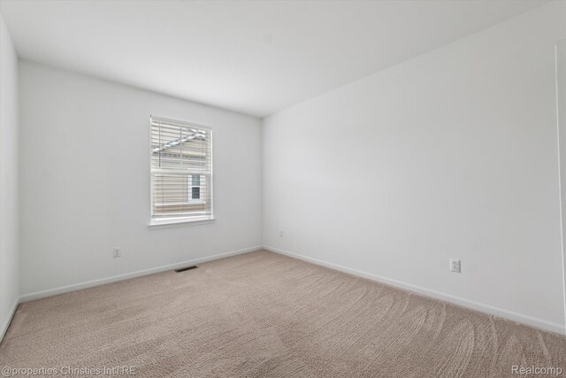 1051 N Sherman Dr Unit B19, Royal Oak, MI 48067 - carpeted empty room with baseboards