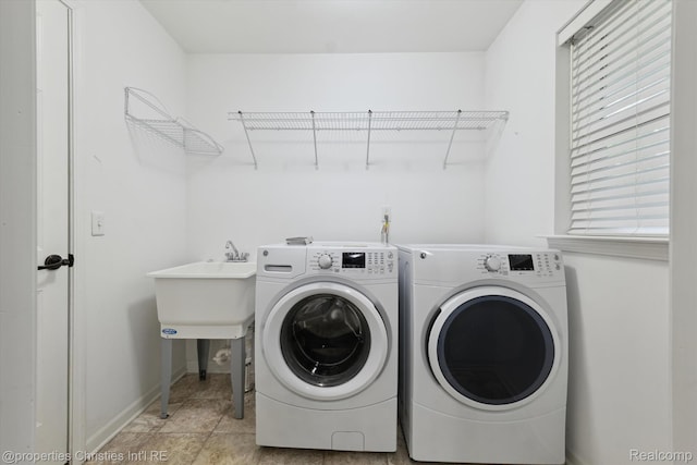 1051 N Sherman Dr Unit B19, Royal Oak, MI 48067 - laundry room featuring washing machine and clothes dryer and baseboards