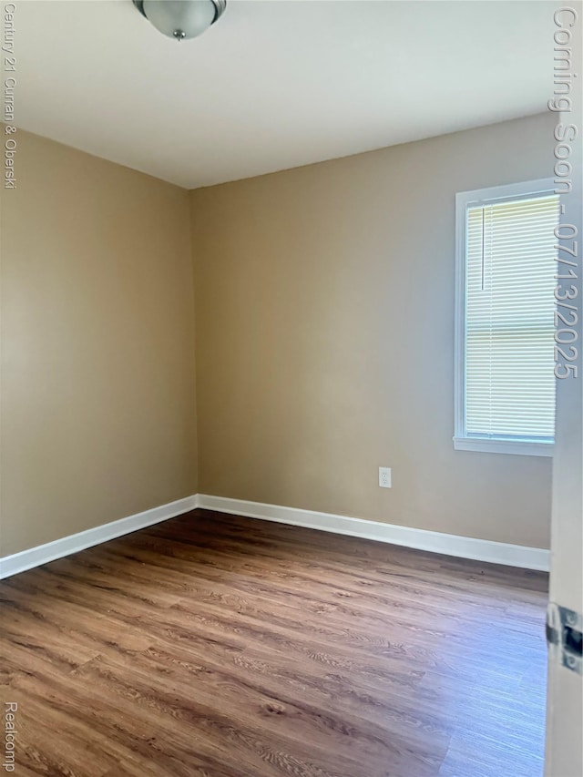 19928 Avon Ave, Detroit, MI 48219 - spare room with dark wood-type flooring and baseboards