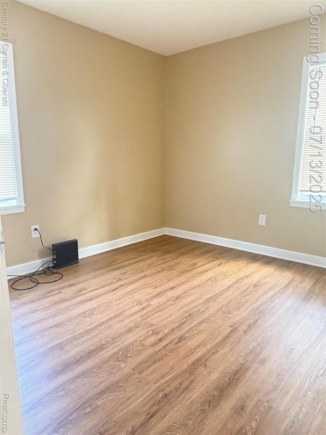19928 Avon Ave, Detroit, MI 48219 - unfurnished room featuring wood finished floors and plenty of natural light