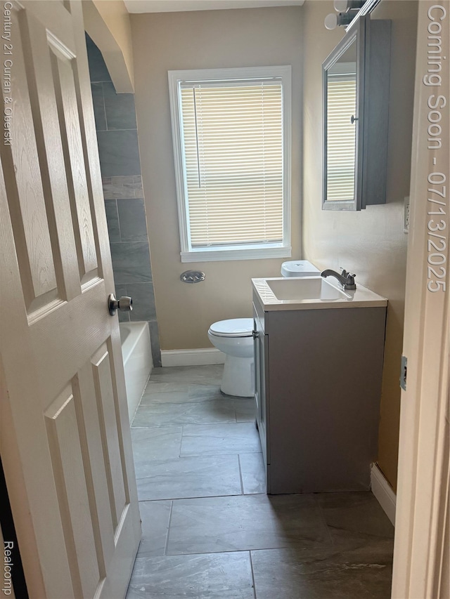 19928 Avon Ave, Detroit, MI 48219 - bathroom with vanity, a tub to relax in, and plenty of natural light