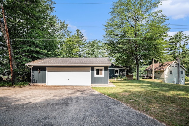6706 E Carrigan Dr, Newaygo, MI 49337 - view of front of property with a front yard and a detached garage