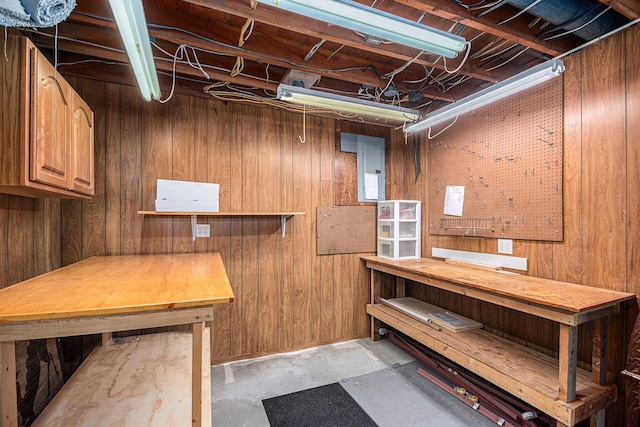 6706 E Carrigan Dr, Newaygo, MI 49337 - unfinished below grade area featuring a workshop area and wooden walls