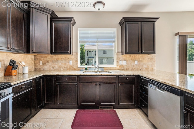 2920 Hartline Dr, Rochester Hills, MI 48309 - kitchen with appliances with stainless steel finishes, light tile patterned floors, light stone counters, and backsplash