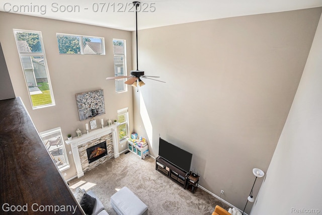 2920 Hartline Dr, Rochester Hills, MI 48309 - carpeted living area featuring a ceiling fan and a fireplace