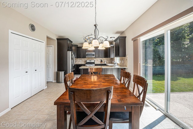2920 Hartline Dr, Rochester Hills, MI 48309 - dining space featuring a chandelier and light tile patterned floors