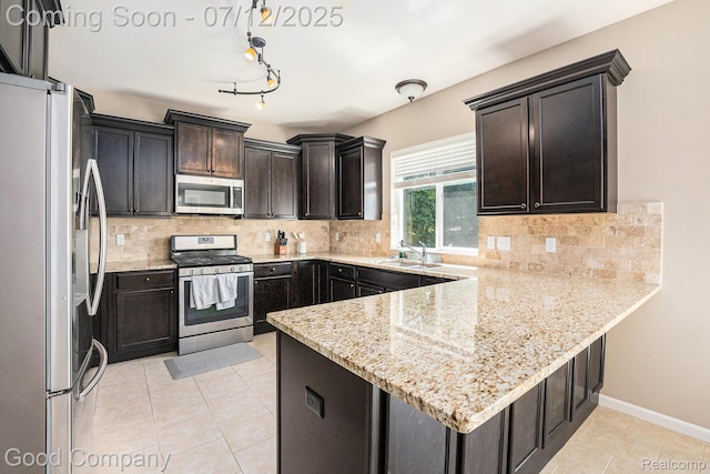 2920 Hartline Dr, Rochester Hills, MI 48309 - kitchen featuring stainless steel appliances, a peninsula, light tile patterned flooring, dark brown cabinets, and tasteful backsplash