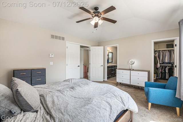 2920 Hartline Dr, Rochester Hills, MI 48309 - carpeted bedroom featuring lofted ceiling, a walk in closet, ceiling fan, and connected bathroom