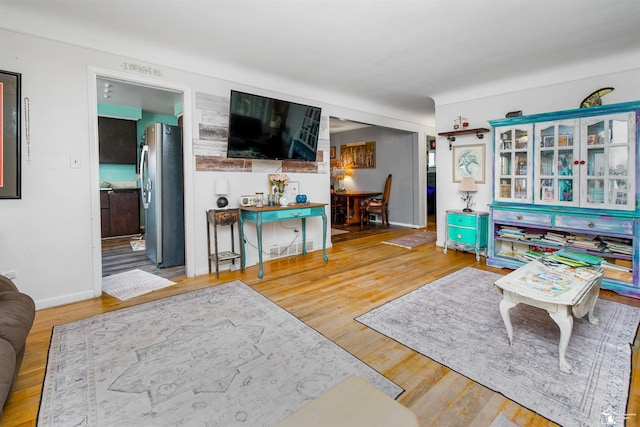 8124 Bailey St, Taylor, MI 48101 - living area featuring wood finished floors and baseboards