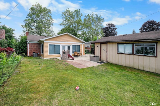 8124 Bailey St, Taylor, MI 48101 - rear view of property featuring a chimney and a patio area