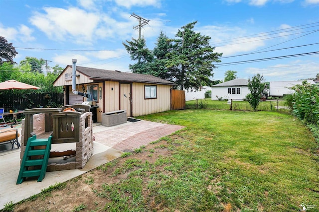 8124 Bailey St, Taylor, MI 48101 - fenced backyard with an outbuilding and a patio