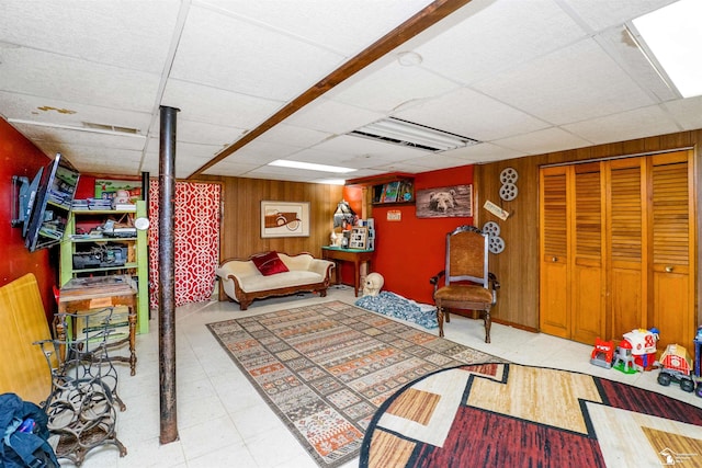 8124 Bailey St, Taylor, MI 48101 - living room with wooden walls and a paneled ceiling