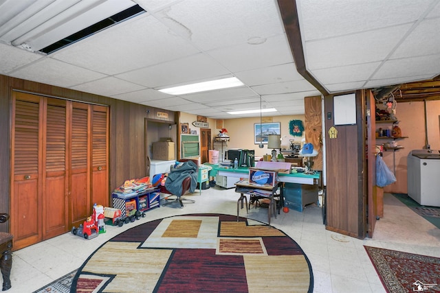 8124 Bailey St, Taylor, MI 48101 - finished basement with a drop ceiling, washer / dryer, wooden walls, and tile patterned floors