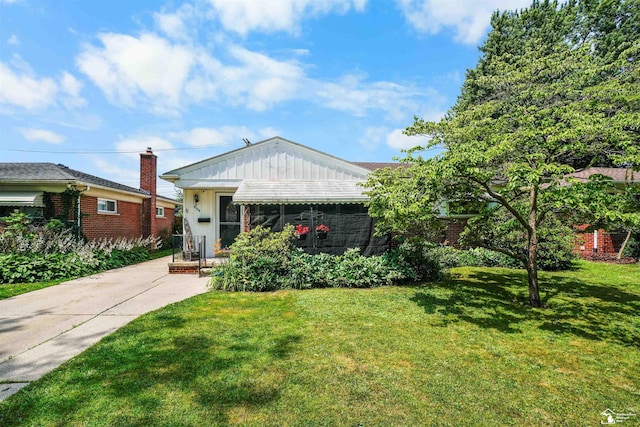 8124 Bailey St, Taylor, MI 48101 - view of front of house with a front yard and brick siding