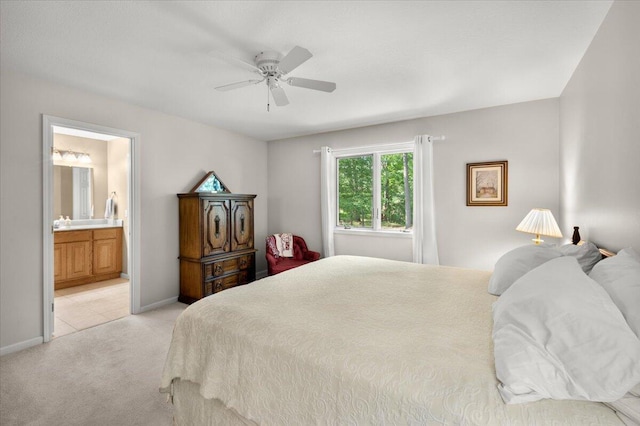 9650 Killdeer Ct, Canadian Lakes, MI 49346 - bedroom featuring light colored carpet, ensuite bathroom, and a ceiling fan