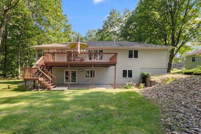 9650 Killdeer Ct, Canadian Lakes, MI 49346 - back of property with a deck, stairway, a patio, and a yard