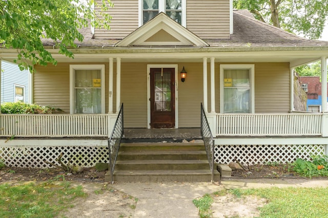 1310 Washington Ave, Kalamazoo, MI 49001 - doorway to property with a porch, a shingled roof, and a chimney