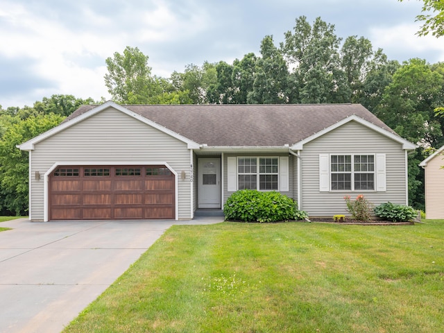 3740 Pristine Ave, Kalamazoo, MI 49048 - ranch-style home featuring driveway, an attached garage, a front yard, and roof with shingles