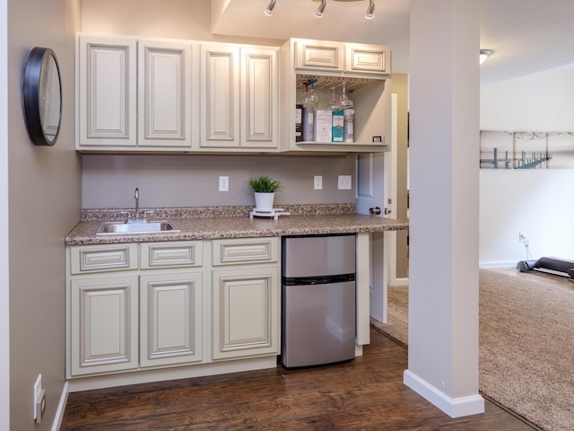 3740 Pristine Ave, Kalamazoo, MI 49048 - kitchen with freestanding refrigerator and dark wood-style flooring