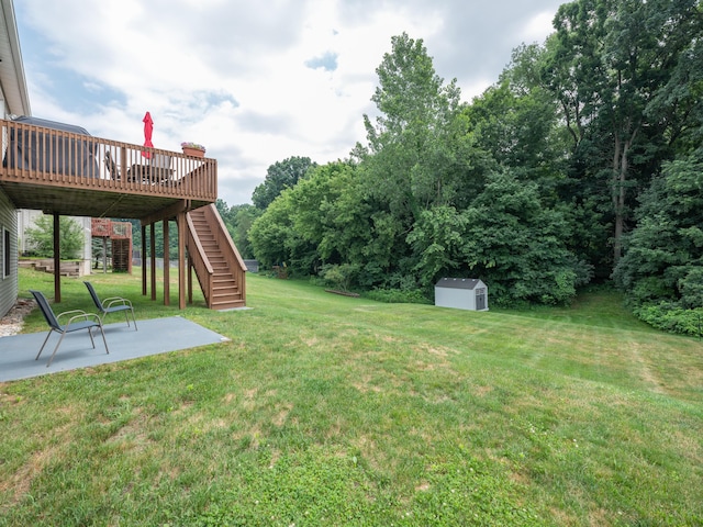 3740 Pristine Ave, Kalamazoo, MI 49048 - view of green lawn featuring stairs, a patio, a storage unit, and a wooden deck