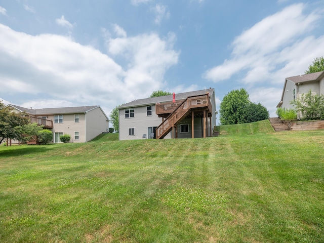3740 Pristine Ave, Kalamazoo, MI 49048 - rear view of house with stairway, a deck, and a lawn