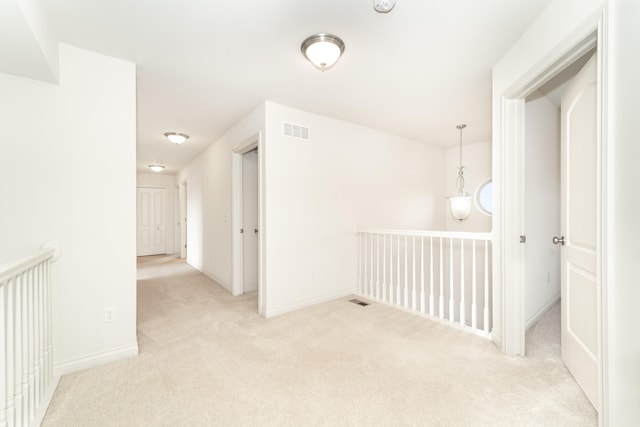 4215 Chandi Ct, Ypsilanti, MI 48197 - corridor featuring carpet floors and an upstairs landing