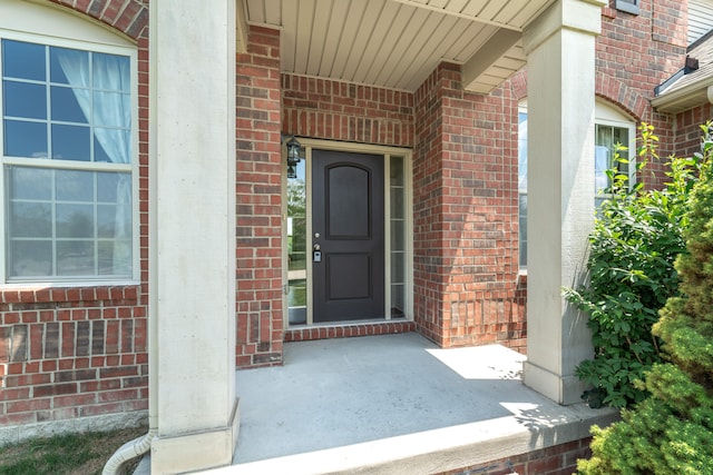 4215 Chandi Ct, Ypsilanti, MI 48197 - view of exterior entry with brick siding and covered porch